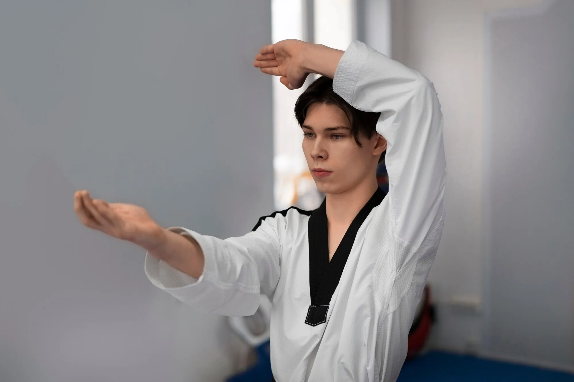 Practitioner in careful stance during a form workshop
